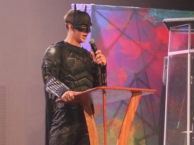 Batman, representing Justitia, the House of Justice, calls for justice and unity on campus. (Photo by Chariti Mealing) 